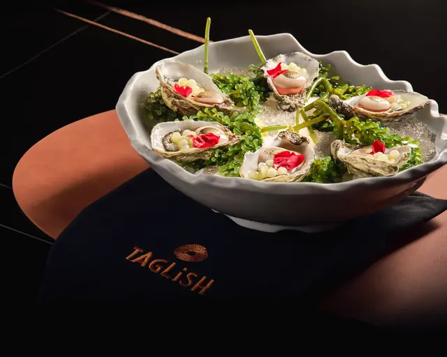 Oysters on crushed ice with sea grapes, over a Taglish napkin